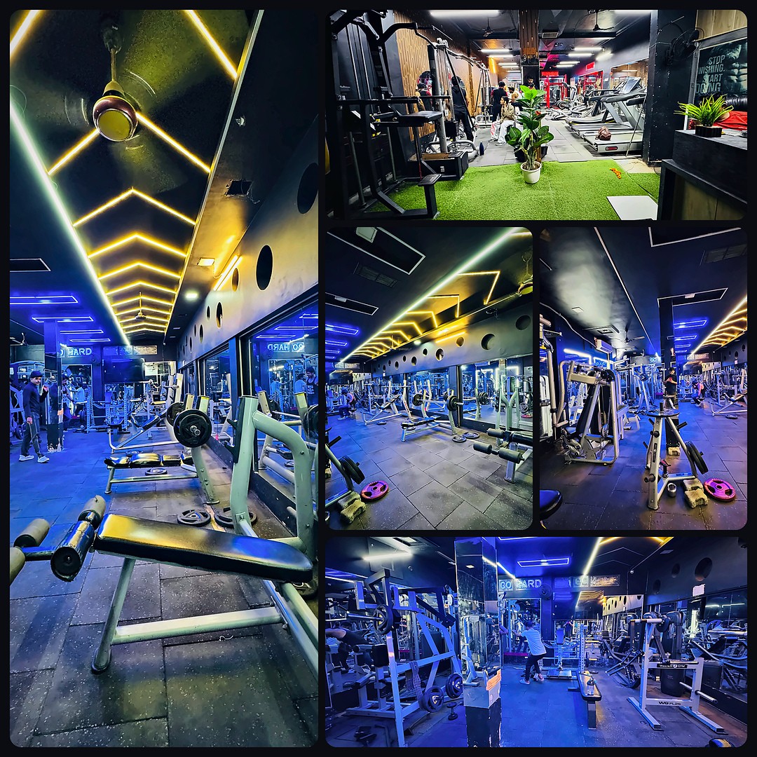 Inside Om Fitness Galaxy Gym: neon-lit training floor, benches, machines and cardio zone